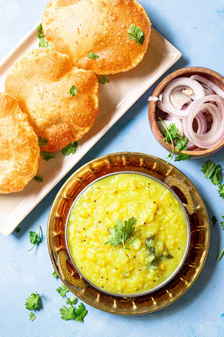 recipe for Poori masala served in a dish with Pooris