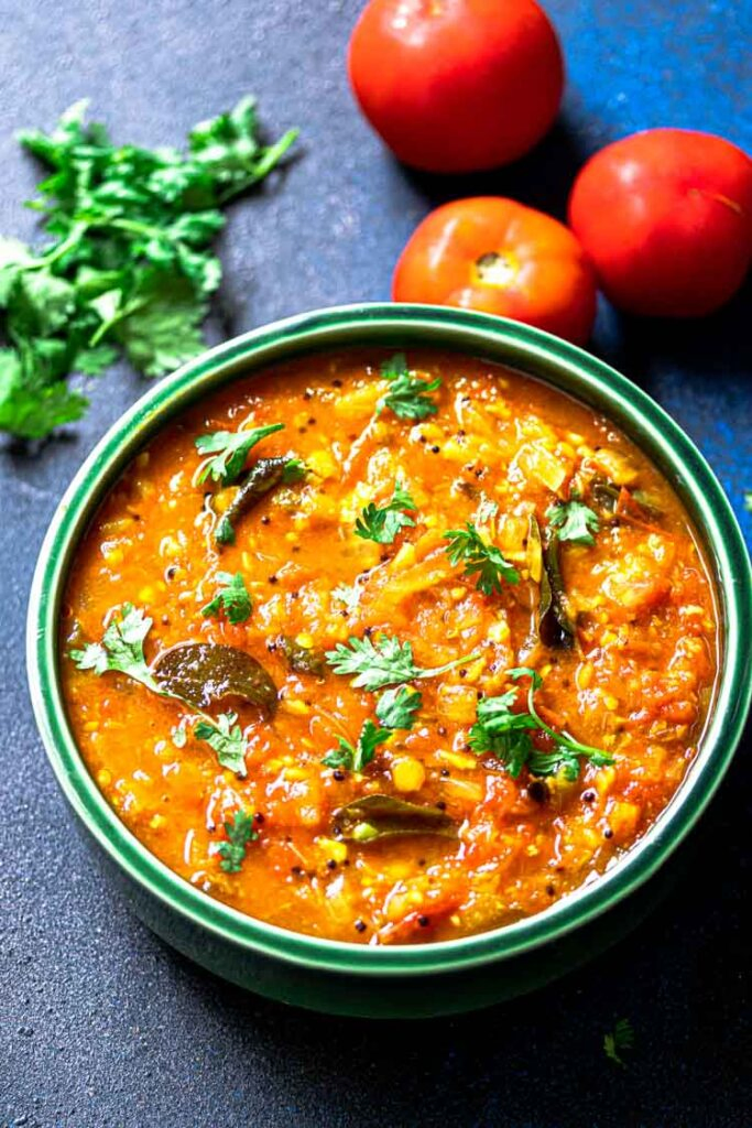 Thakkali Bajji served in a green ceramic bowl, Tomato Chutney food photography