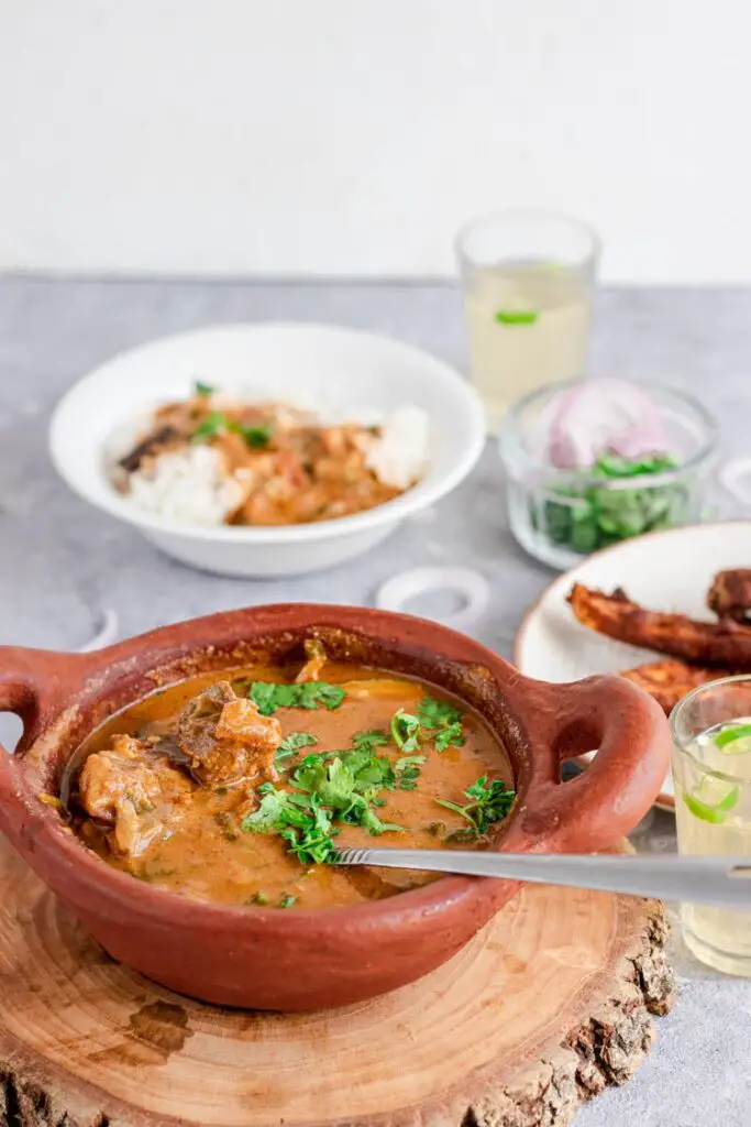 Mutton kuzhambu in a bowl, south indian mutton kulambu, mutton kuzhambu