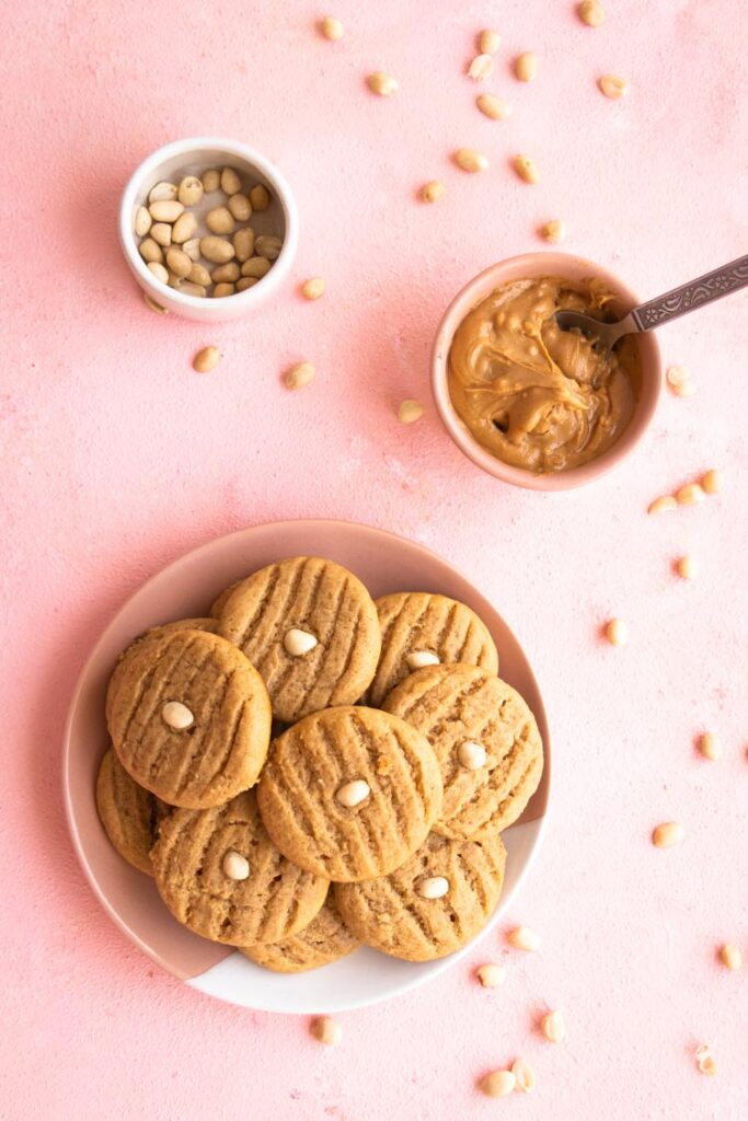 Peanut Butter Cookies stacked on a plate, Top Down Photo of cookies on a plate, peanut butter, peanuts