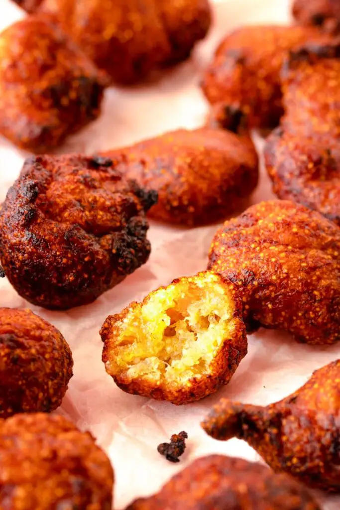 banana fritter food photography, woman reaching for a banana fritter